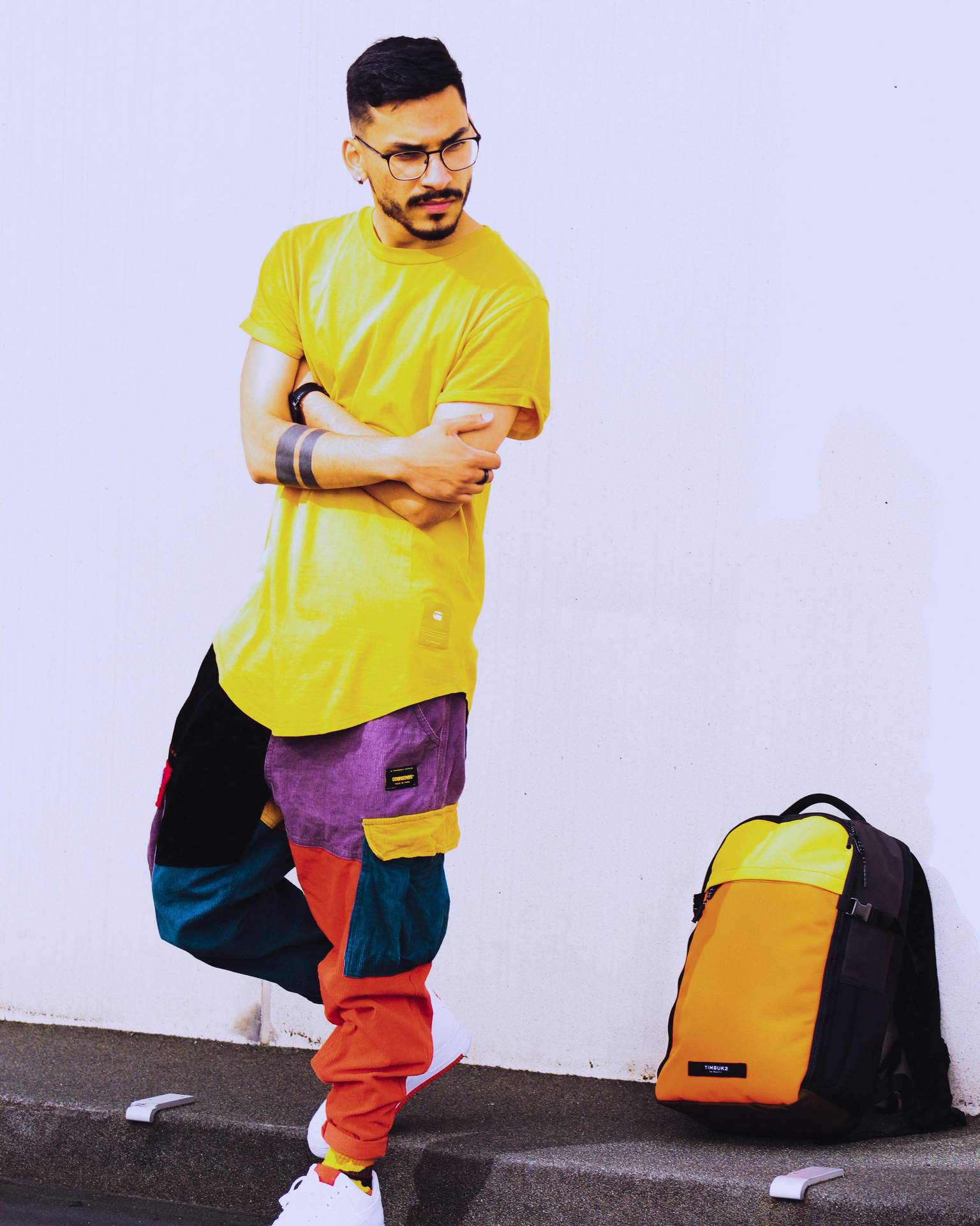 Young man with yellow T-shirt and colorful pants Young man with yellow T-shirt and colorful pants