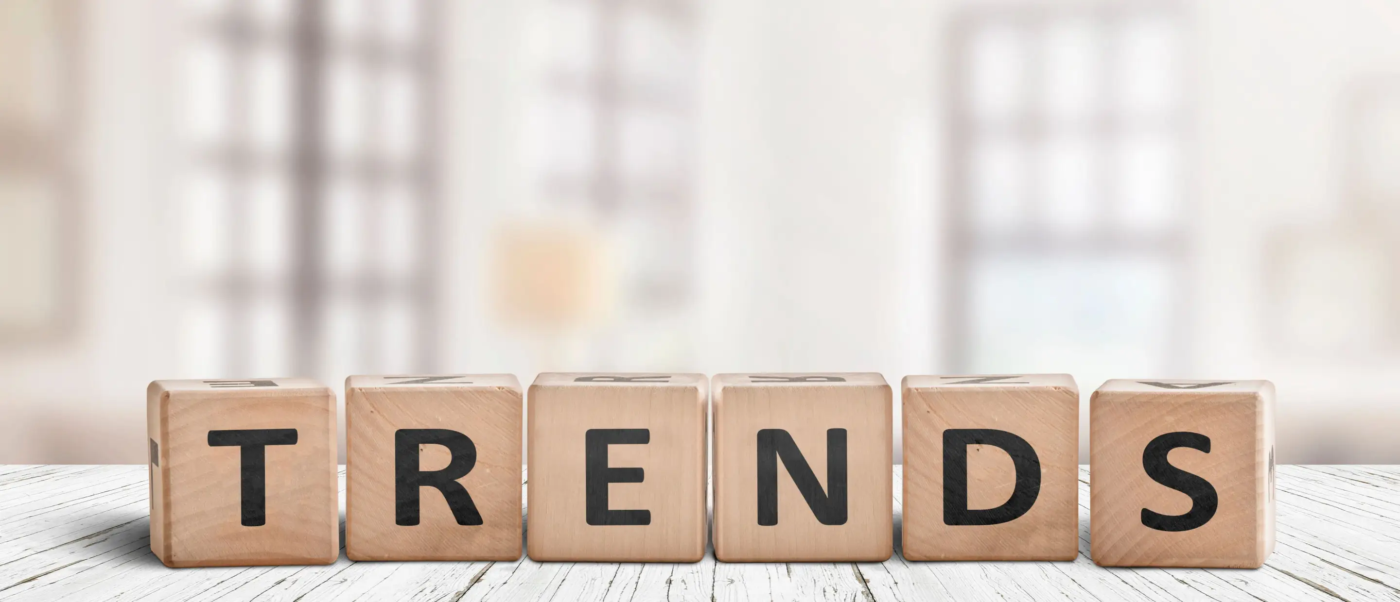 T-Shirt Design Trends 2026 – Creative Fashion Trends in Focus Wooden blocks spelling 'Trends' – symbolic image for T-shirt design trends 2026, creative styles & custom shirt creation